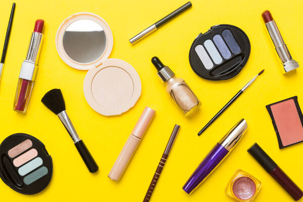 Professional makeup tools. Top view. Flat lay. Beauty, decorative cosmetics. Makeup brushes set and color eyeshadow palette on table background. Minimalistic style.