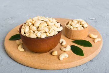 cashew nuts in wooden bowl on table background. top view. Space for text. Healthy food