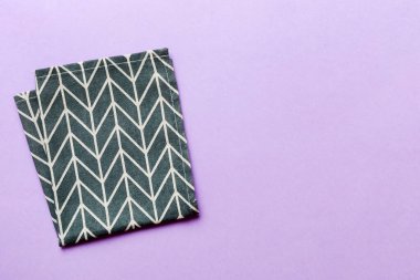 top view with blue kitchen napkin isolated on table background. Folded cloth for mockup with copy space, Flat lay. Minimal style.