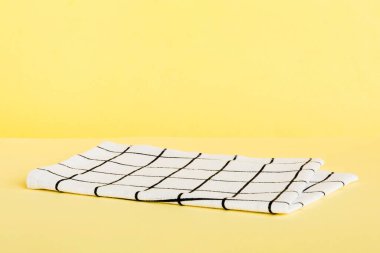 top view with white empty kitchen napkin isolated on table background. Folded cloth for mockup with copy space, Flat lay. Minimal style.