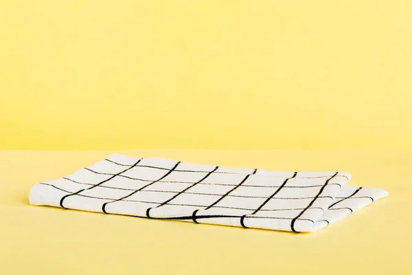 stock image top view with white empty kitchen napkin isolated on table background. Folded cloth for mockup with copy space, Flat lay. Minimal style.