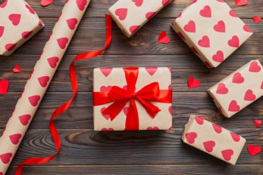 Creative gift box with decorations for the holiday, top view. Birthday and valentine present.