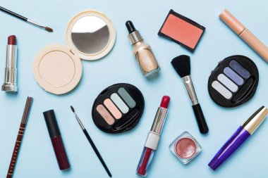 Professional makeup tools. Top view. Flat lay. Beauty, decorative cosmetics. Makeup brushes set and color eyeshadow palette on table background. Minimalistic style.