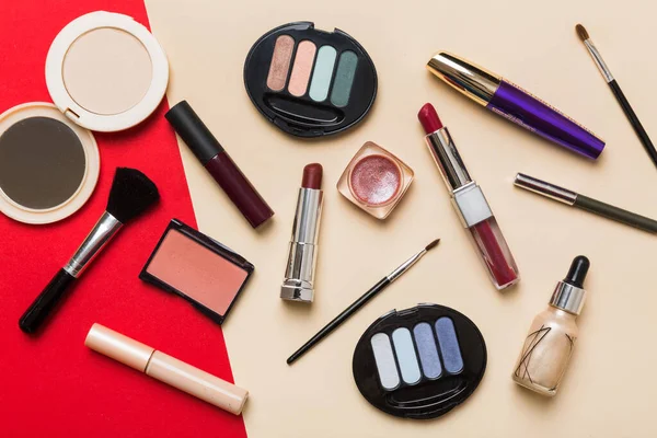 Professional makeup tools. Top view. Flat lay. Beauty, decorative cosmetics. Makeup brushes set and color eyeshadow palette on table background. Minimalistic style.