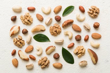 Composition of nuts , flat lay - mix hazelnuts, cashews, almonds on table background. healthy eating concepts and food background.