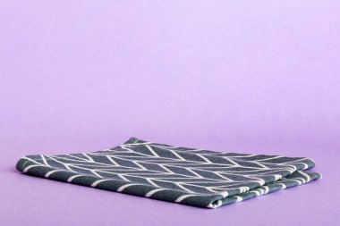 top view with blue kitchen napkin isolated on table background. Folded cloth for mockup with copy space, Flat lay. Minimal style.