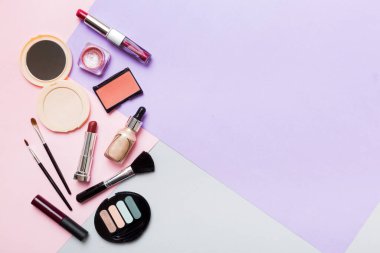 Professional makeup tools. Top view. Flat lay. Beauty, decorative cosmetics. Makeup brushes set and color eyeshadow palette on table background. Minimalistic style.