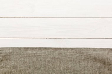 top view with gray kitchen napkin isolated on table background. Folded cloth for mockup with copy space, Flat lay. Minimal style.