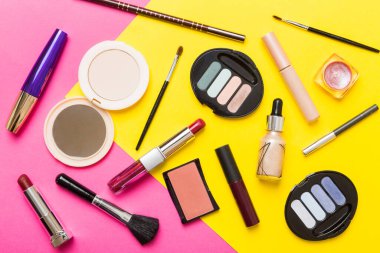 Professional makeup tools. Top view. Flat lay. Beauty, decorative cosmetics. Makeup brushes set and color eyeshadow palette on table background. Minimalistic style.