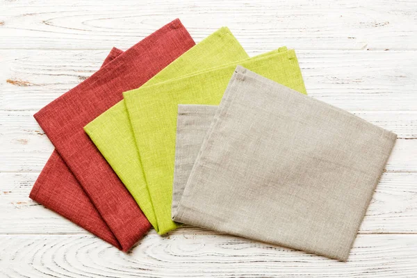 top view with gray kitchen napkin isolated on table background. Folded cloth for mockup with copy space, Flat lay. Minimal style.