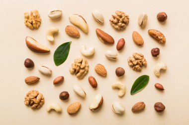 Composition of nuts , flat lay - mix hazelnuts, cashews, almonds on table background. healthy eating concepts and food background.