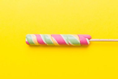 Colorful candies, lollypop on the colorful background, multicolored minimal style top view.