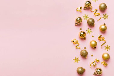 Christmas composition. a pattern of christmas balls on colored background. Flat lay, top view New year decor.