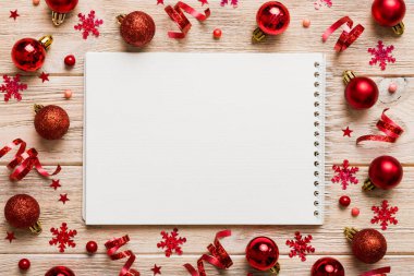 Christmas blank greeting card mock-up scene. Creative layout made of Christmas tree branches and paper card note. Flat lay. Nature New Year concept.