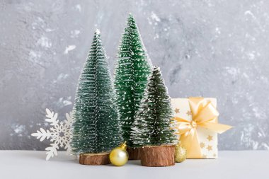 Christmas composition. craft Gift box, small tree, branches and craft DIY decorations on white background. New year concept. Christmas home decoration Flat lay, top view, copy space.