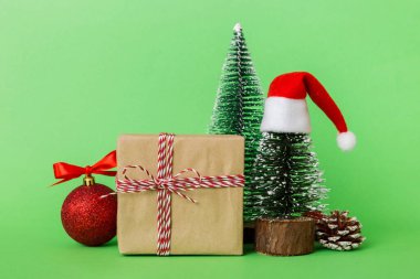 Christmas composition. Gifts, small tree, branches and craft DIY decorations on white background. New year concept. Christmas home decoration Flat lay, top view, copy space.
