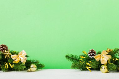 New Year Christmas tree toy, branches of a christmas tree, New Year decorations on a colored background.