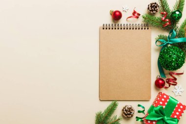 Christmas blank greeting card mock-up scene. Creative layout made of Christmas tree branches and paper card note. Flat lay. Nature New Year concept.