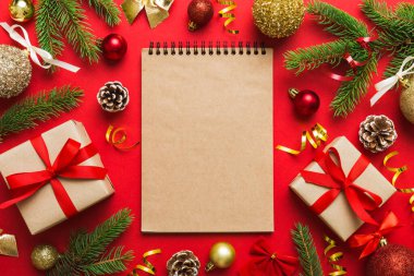 Christmas blank greeting card mock-up scene. Creative layout made of Christmas tree branches and paper card note. Flat lay. Nature New Year concept.