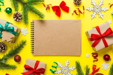 Christmas blank greeting card mock-up scene. Creative layout made of Christmas tree branches and paper card note. Flat lay. Nature New Year concept.