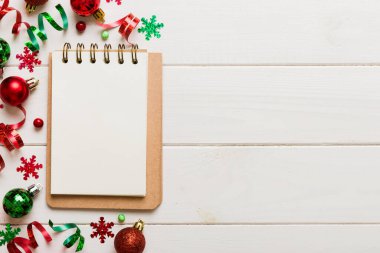 Christmas blank greeting card mock-up scene. Creative layout made of Christmas tree branches and paper card note. Flat lay. Nature New Year concept.