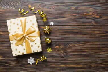 Top view Flat lay Christmas decorations and gift box on colored background with copy space. Christmas or Happy New Year composition.