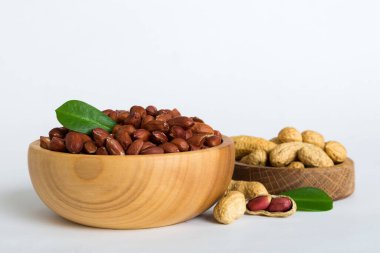 Fresh healthy peanuts in bowl on colored table background. Top view Healthy eating bertholletia concept. Super foods.