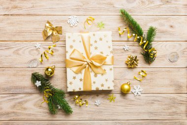 Top view Flat lay Christmas decorations and gift box on colored background with copy space. Christmas or Happy New Year composition.