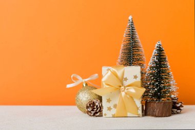 Christmas composition. craft Gift box, small tree, branches and craft DIY decorations on white background. New year concept. Christmas home decoration Flat lay, top view, copy space.