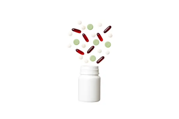 Pílulas Multicoloridas Cápsulas Garrafa Plástico Sobre Fundo Colorido Espaço Cópia — Fotografia de Stock