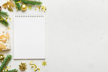 Christmas blank greeting card mock-up scene. Creative layout made of Christmas tree branches and paper card note. Flat lay. Nature New Year concept.