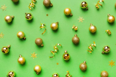 Christmas composition. a pattern of christmas balls on colored background. Flat lay, top view New year decor.