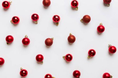 Christmas composition. a pattern of christmas balls on colored background. Flat lay, top view New year decor.