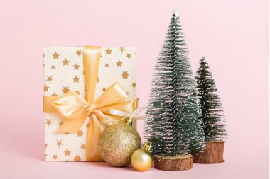 Christmas composition. craft Gift box, small tree, branches and craft DIY decorations on white background. New year concept. Christmas home decoration Flat lay, top view, copy space.