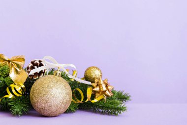 New Year Christmas tree toy, branches of a christmas tree, New Year decorations on a colored background.