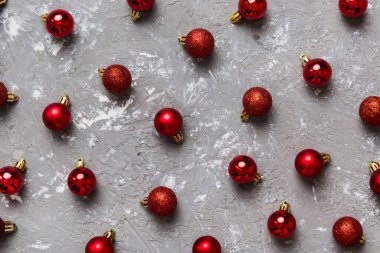 Christmas composition. a pattern of christmas balls on colored background. Flat lay, top view New year decor.