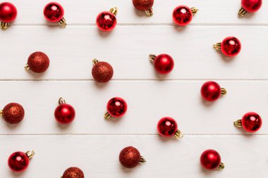 Christmas composition. a pattern of christmas balls on colored background. Flat lay, top view New year decor.