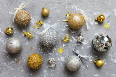 Christmas ball on colored background. decoration bauble with ribbon bow with copy space.