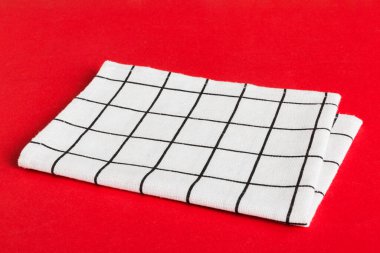 top view with white empty kitchen napkin isolated on table background. Folded cloth for mockup with copy space, Flat lay. Minimal style.