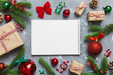 Christmas blank greeting card mock-up scene. Creative layout made of Christmas tree branches and paper card note. Flat lay. Nature New Year concept.