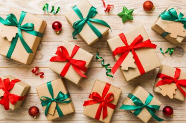 Colored craft gift boxes with colorful ribbons on colored background. Collection of Christmas present boxes .