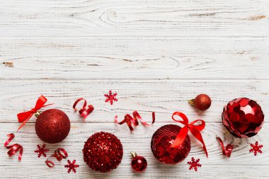 Christmas ball on colored background. decoration bauble with ribbon bow with copy space.