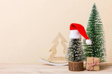 Christmas composition. Gifts, small tree, branches and craft DIY decorations on white background. New year concept. Christmas home decoration Flat lay, top view, copy space.