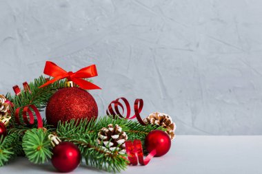 New Year Christmas tree toy, branches of a christmas tree, New Year decorations on a colored background.