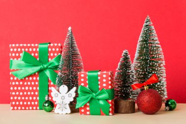 Christmas composition. craft Gift box, small tree, branches and craft DIY decorations on white background. New year concept. Christmas home decoration Flat lay, top view, copy space.