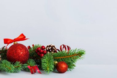 New Year Christmas tree toy, branches of a christmas tree, New Year decorations on a colored background.