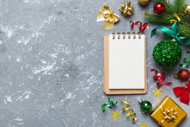 Christmas blank greeting card mock-up scene. Creative layout made of Christmas tree branches and paper card note. Flat lay. Nature New Year concept.