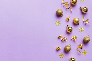 Christmas composition. a pattern of christmas balls on colored background. Flat lay, top view New year decor.
