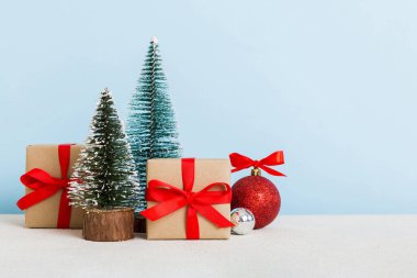 Christmas composition. craft Gift box, small tree, branches and craft DIY decorations on white background. New year concept. Christmas home decoration Flat lay, top view, copy space.