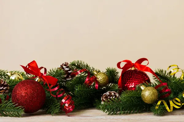 New Year Christmas tree toy, branches of a christmas tree, New Year decorations on a colored background.